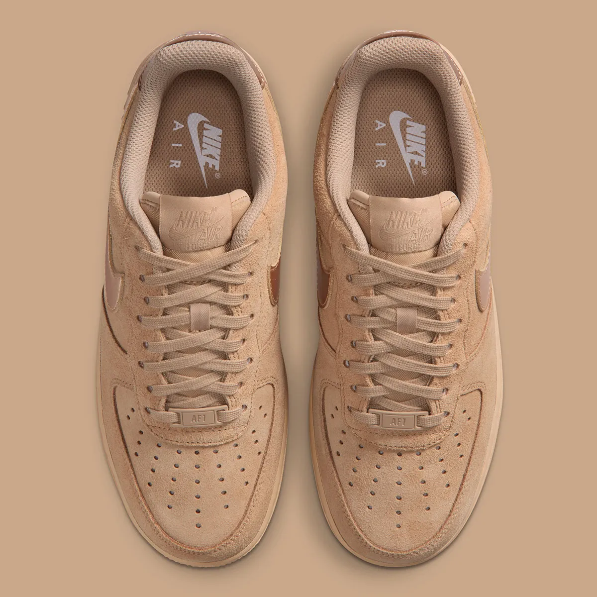 The Nike Air Force 1 Low Pins Metallic Branding On Two Suede Looks