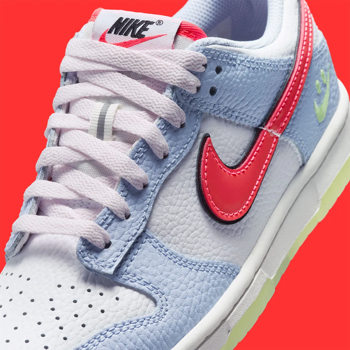 The Nike Dunk Low Says Cheese With A “Smiley Swoosh”