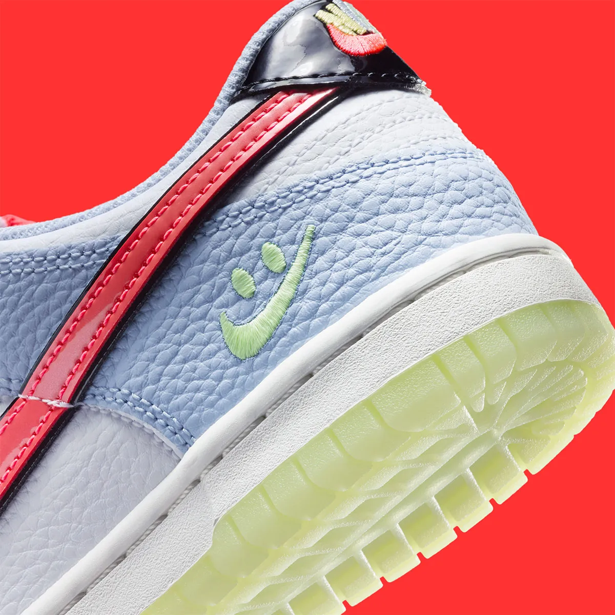 The Nike Dunk Low Says Cheese With A “Smiley Swoosh”
