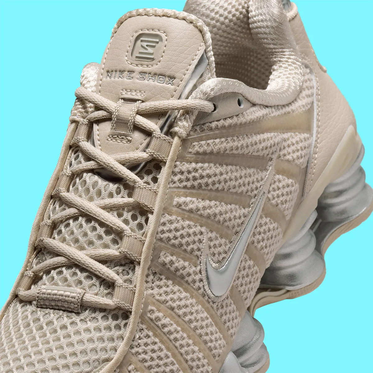 Cream And Metallic Silver Clash On The Nike Shox TL